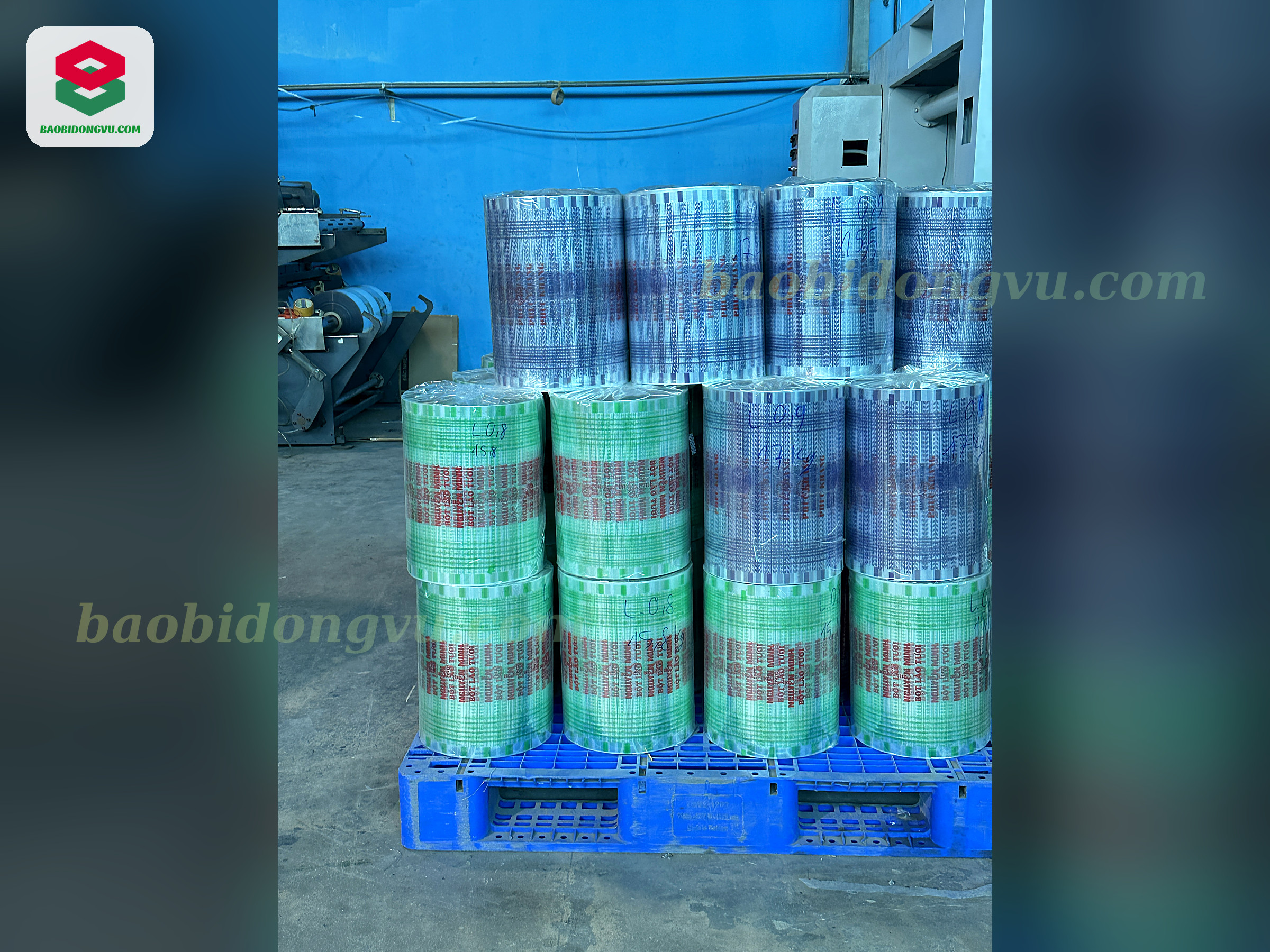 Printed laminated rollstock film rolls stacked on a pallet, ready to ship from the Dong Vu Packaging factory