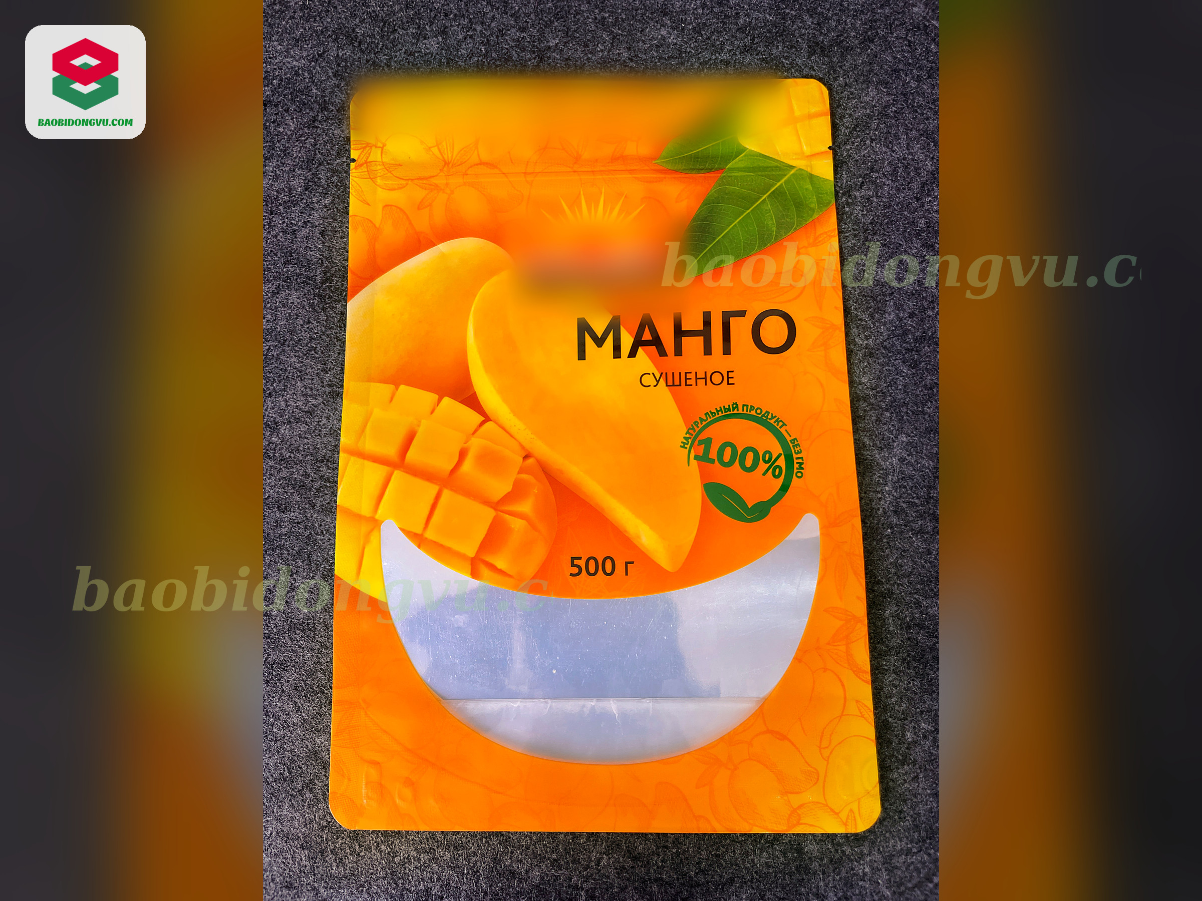 Orange stand-up zipper pouch with frosted window for 500 g dried mango, export packaging from Vietnam